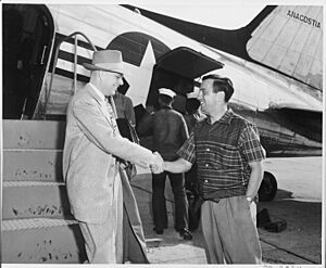 Photograph of Charles Murphy, Special Counsel to the President, shaking hands with White House aide Richard Neustadt... - NARA - 200544