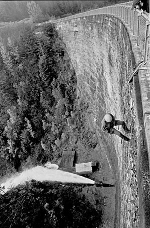 Salmon Creek Dam Spillway pipe of 4 ft dia in full flow and an adventurous Climb down the dam slope