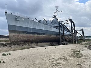 The port side of the USS Kidd on dry land.