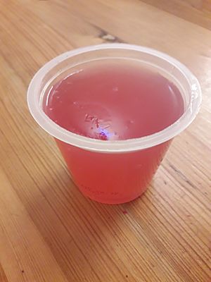 A pot of strawberry jelly