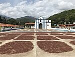 Cacao drying square in front of church