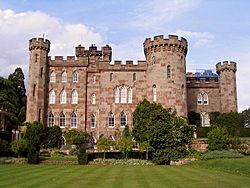 A country house with appearance of a castle with towers and battlements