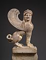 Marble capital and finial in the form of a sphinx