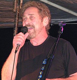 Country music singer Earl Thomas Conley singing into a microphone