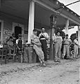 Fourth of July, near Chapel Hill, North Carolina. Rural filling stations become community centers and general loafing grounds. The men in the baseball suits are on a local team which will play a game (3971750496)