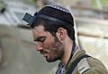 IDF soldier kippah put on tefillin-small