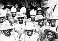 Indian soldiers mingle with men of the 81st West African Division after the latter had arrived in India for jungle training. The first African colonial troops to fight outside Africa, the 81st Division went on to Burma IND2864