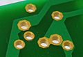 Plated-through holes on an electronic circuit board