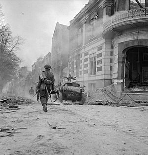 Troops and scout car in Arnhem 1945