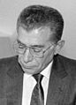 Ismail Safa Giray signing financial agreements (cropped)