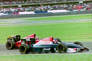 Jean Alesi - Ferrari F193A dives inside Ukyo Katayama - Tyrrell 020C at the 1993 British Grand Prix (33530333172).jpg