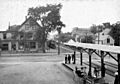 Kentville Railway Station platform and Aberdeen Street with Dominion Atlantic Railway train approaching, circa 1910