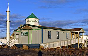 Midnight Sun mosque and photographer's shadow in the midnight sun, Inuvik, NT.jpg