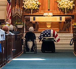 Roberta McCain beside her son John's casket (30567777018)