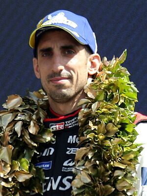 Ryo Hirakawa, Brendon Hartley & Sebastien Buemi take the podium for 2nd in Hypercar at the 2023 Le Mans (53468554280) (cropped).jpg