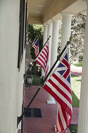 Sideview of flags on colonial building