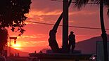 Sunset at the El Pescador Playa Norte monument, Mazatlan