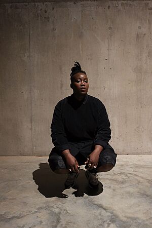 Tawiah crouching (high res) photo credit Studio Myrrh