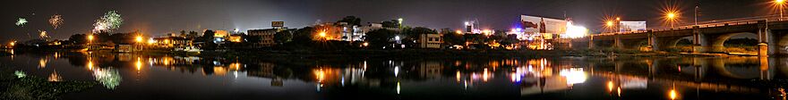 a panoramic view of a river and the city skyline in the harbour