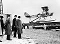 Winston Churchill and the Secretary of State for War waiting to see the launch of a de Havilland Queen Bee radio-controlled target drone, 6 June 1941. H10307