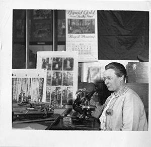 Eloise Gerry (1885-1970), shown at microscope.jpg