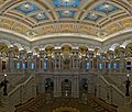 Photograph of the elaborately detailed Great Hall of the Library of Congress, with grand stairways and a finely worked ceiling.