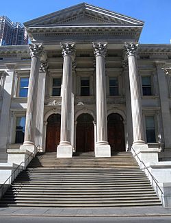 A close-up of the front steps and entrance portico of the Tweed Courthouse