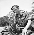 A soldier from 101st Light Anti-Aircraft Regiment prepares for D-Day by reading his French handbook at a camp near Portsmouth, 29 May 1944. H38831