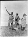 Crow Indians offering food -Edward S. Curtis
