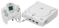 An NTSC Sega Dreamcast Console and controller with VMU.