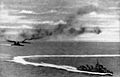 HMS Prince of Wales and HMS Repulse underway with a destroyer on 10 December 1941 (HU 2762)