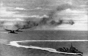 HMS Prince of Wales and HMS Repulse underway with a destroyer on 10 December 1941 (HU 2762)