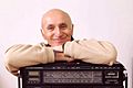 Zoran Modli beside the radio portrait by Andrej Cukic