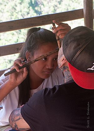 Grace Palicas doing a facial tattoo
