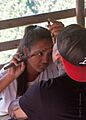 Grace Palicas doing a facial tattoo
