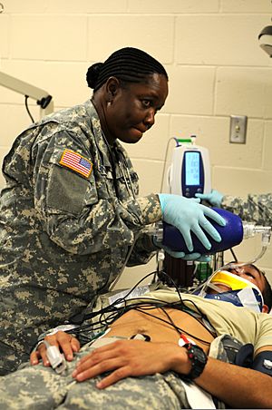 Staff Sgt. Claudia Bennett, left, a medic, from 7217th Medical Support Unit out of Miami, Fla., uses a bag valve mask on an injured Soldier on Fort Hunter Liggett, Calif., Aug. 2, 2011 110802-A-AJ827-497