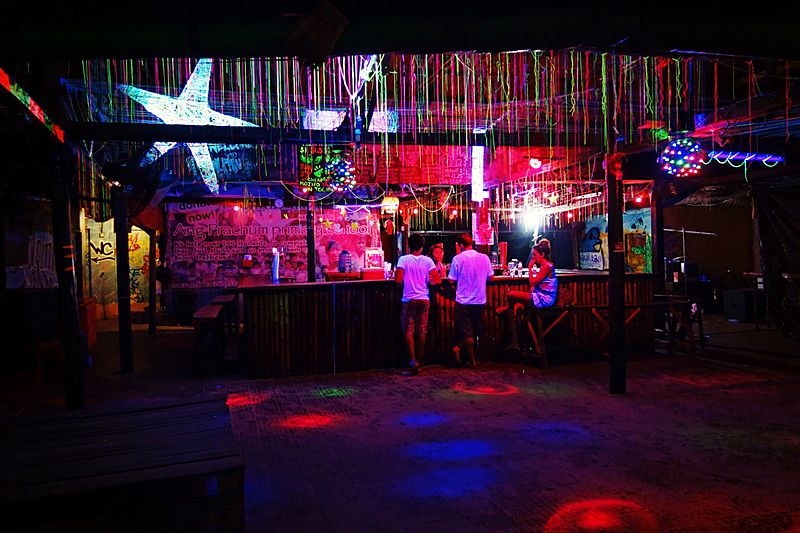 Three customers at a bar
