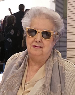 picture of a gray-haired woman wearing sunglasses