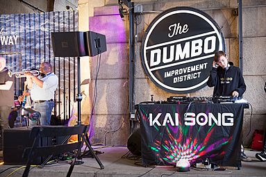 DJ Kai Song setting up in the DUMBO Archway