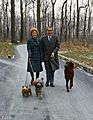 President Richard Nixon and Pat Nixon walking their dogs at Camp David