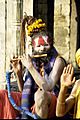 A sadhu playing flute, Benaras
