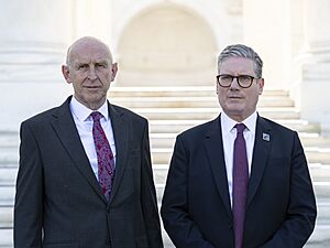 British Defence Secretary John Healey, left, and British Prime Minister Keir Starmer, right, on the West Steps of the Memorial Amphitheater at Arlington National Cemetery, Arlington, Virginia on July 11, 2024 (cropped)