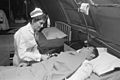Da Nang, South Vietnam...United States Navy nurse Lieutenant Commander Joan Brouilette checks the condition of Pfc.... - NARA - 558531