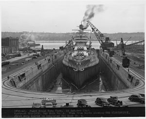 Dry Dock No. 4. View from North showing USS MISSISSIPPI, first ship docked in completed Dry Dock No. 4. - NARA - 299647