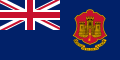 Dark blue flag with red and yellow castle to right and Union Flag in top-left quarter.