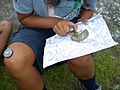AGESCI Guide using a compass in a topography contest