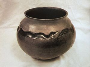 Carved black-on-black pot by Tewa artist Sara Fina Tafoya, early 20th C