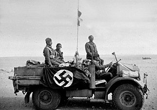 Indian soldiers with swastika flag after re-occupation of Benghazi 1941