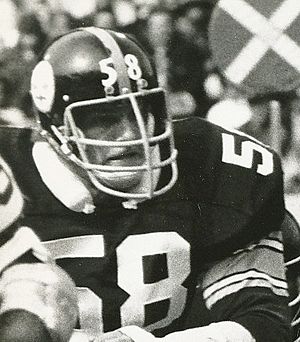 Candid black and white photograph of Lambert during a game wearing a #58 Pittsburgh Steelers uniform