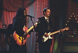 Photograph of Tracy Chapman and Eric Clapton Performing at a White House Special Olympics Dinner - NARA - 6037507
